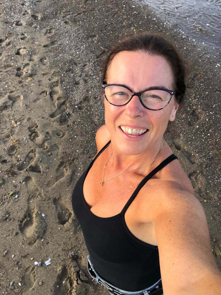 Shelley Butler in a selfie by the seashore.